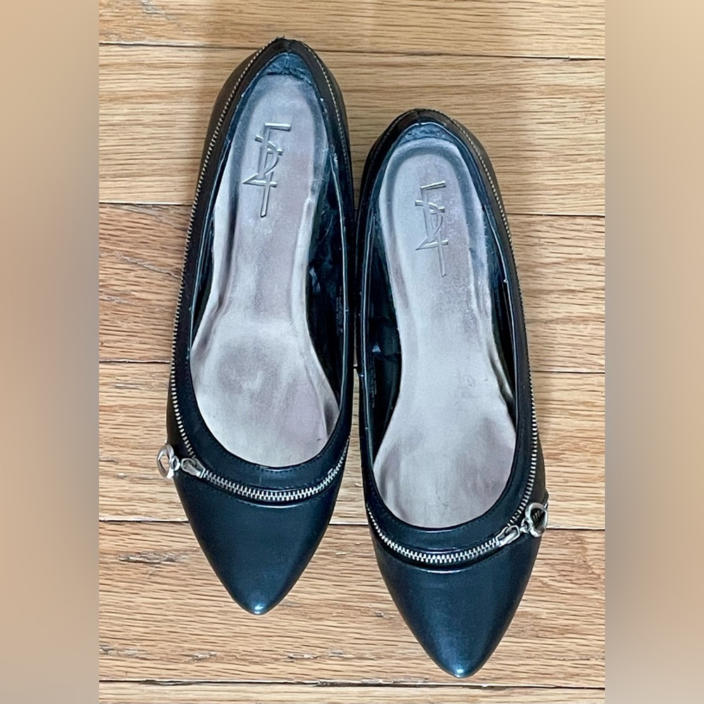 Black ballet flats with zipper detail and heart embellishment, like new